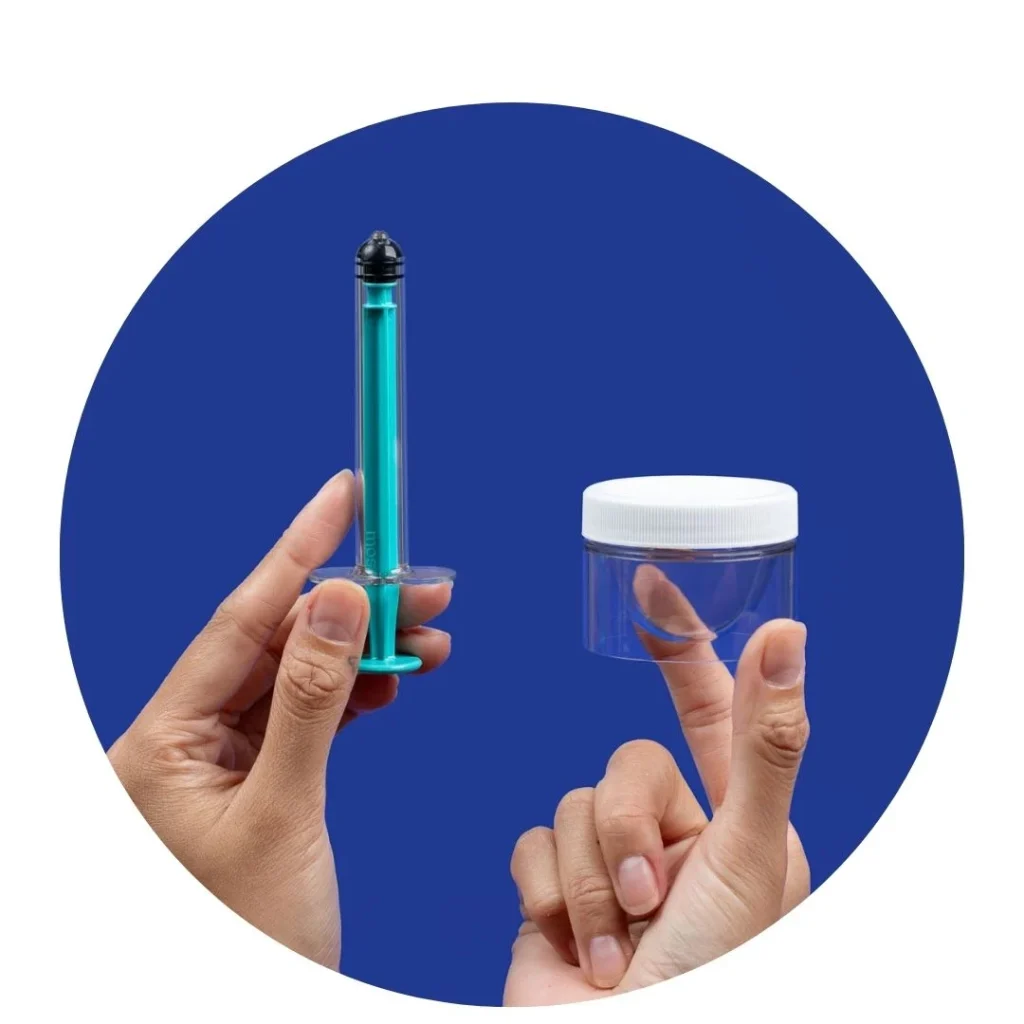hands holding a teal syringe and a clear container against a blue background